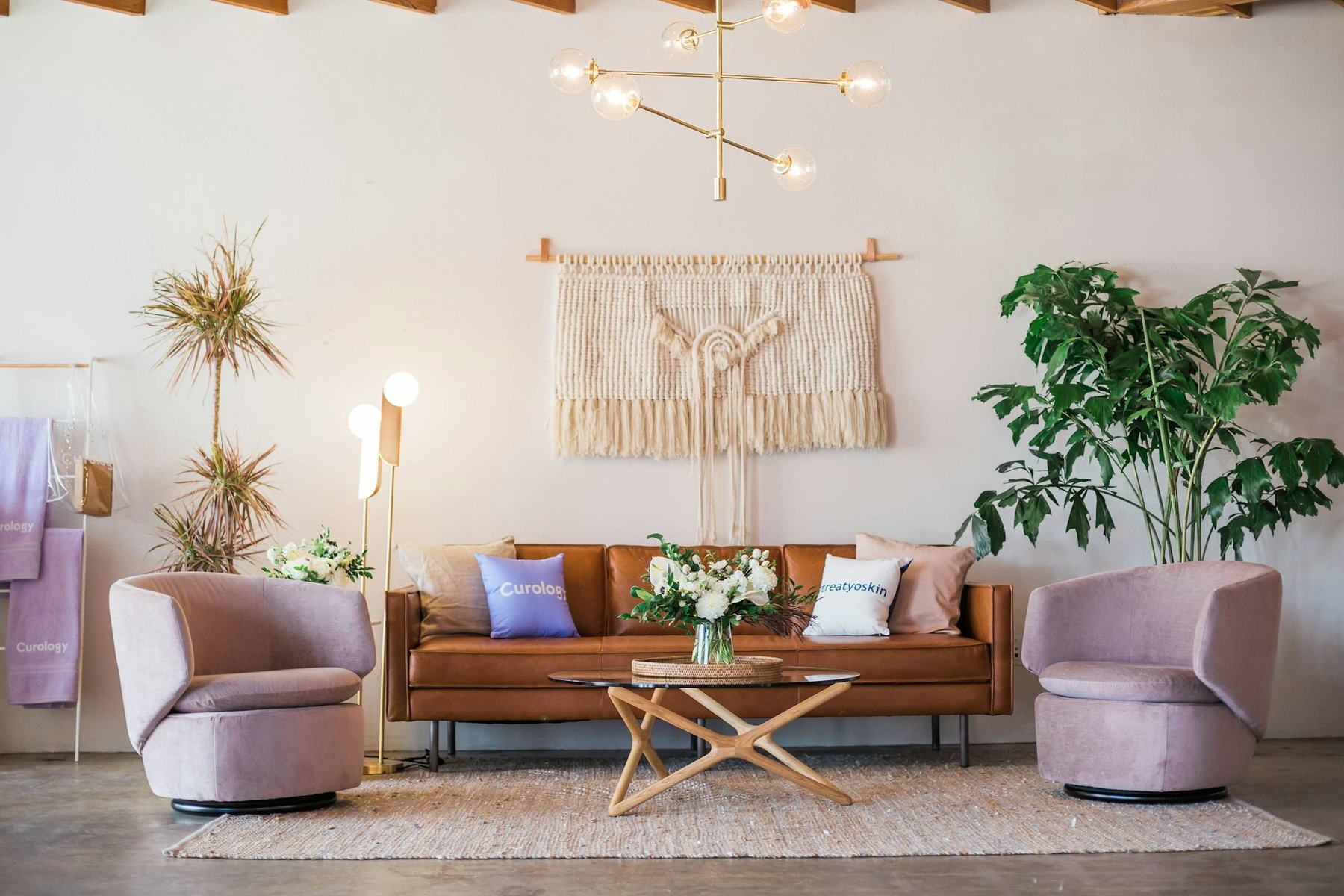 Styled living room with velvet sofa and pendant lighting